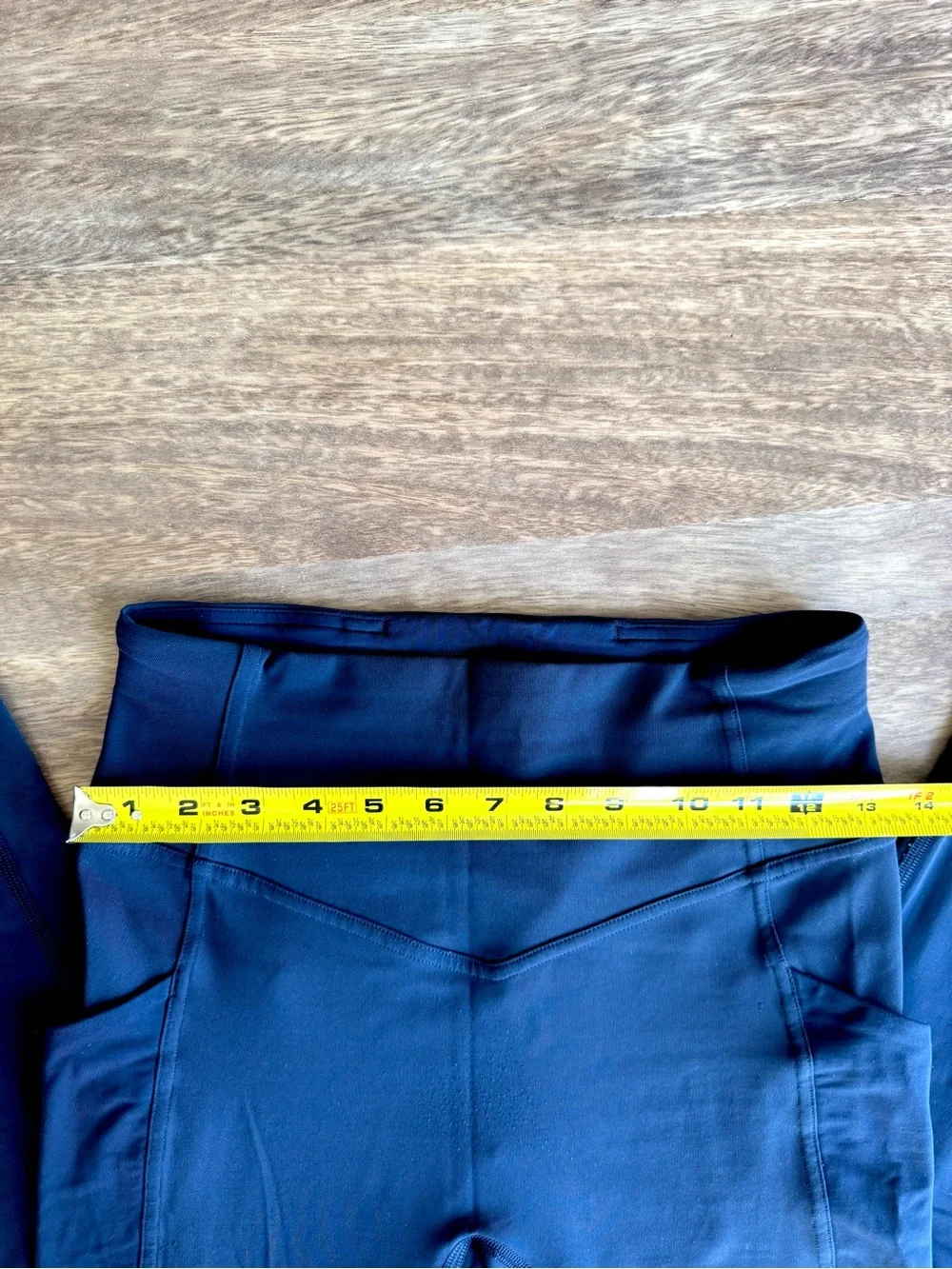 Lululemon performance leggings in a dark navy blue with Side Pockets